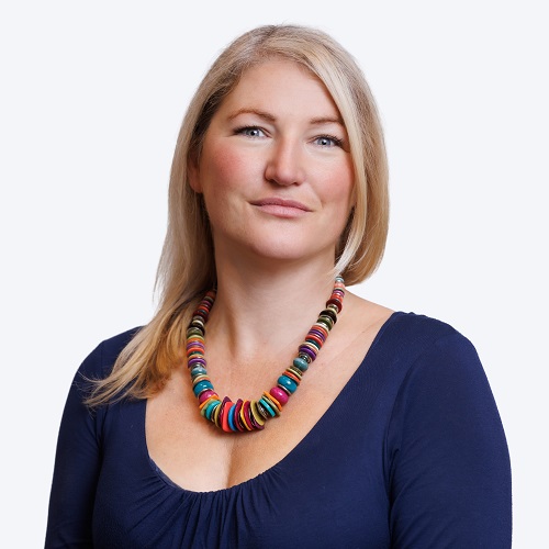 Penny Dewar, a woman in a blue dress with blonde hair