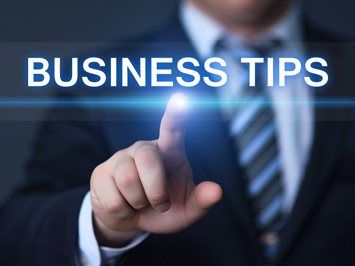 starting a business in England - businessman pointing to top business tips written in words