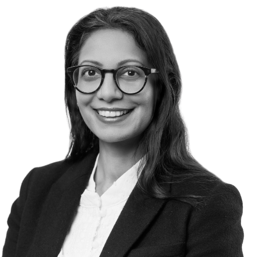 woman with glasses in a suit