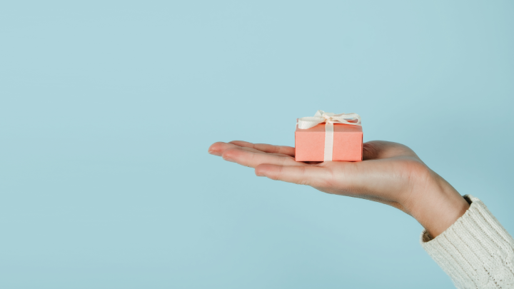Strategic lifetime gifting image of a hand holding a gift