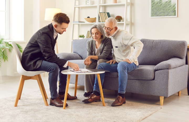 A picture of an older couple signing capacity documents